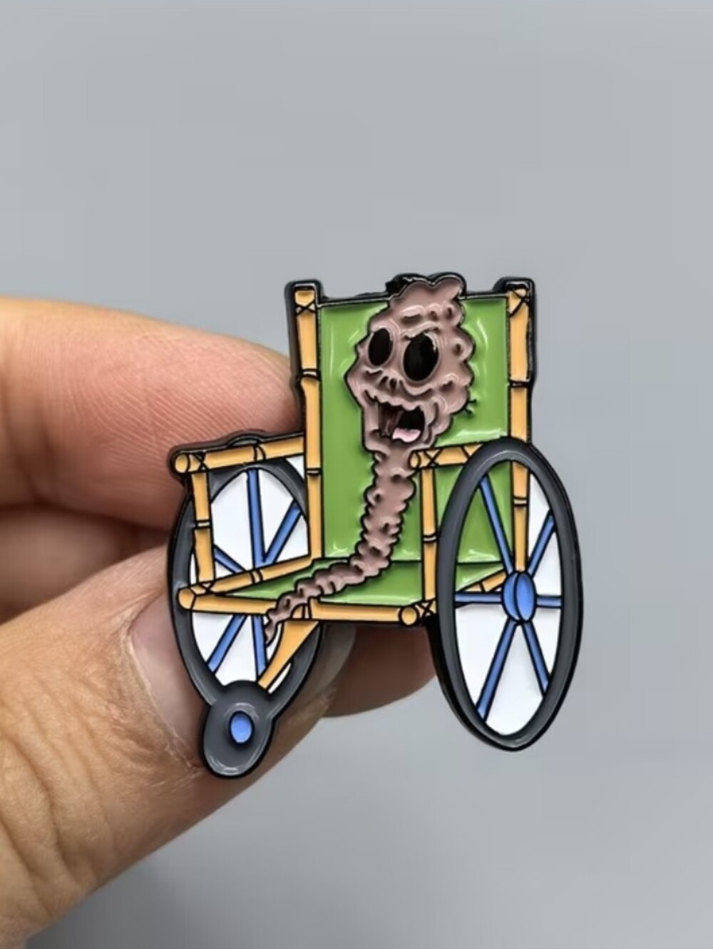 SpongeBob Squarepants Chocolate Green Wheelchair Brooch with Pink Skull Accent